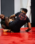 BJJ Rash Guard in Black with Death Cuddles in action 2