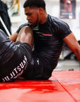 BJJ Rash Guard in Black with Death Cuddles in action 4