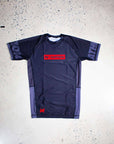 Black short sleeve Jiu Jitsu Essentials BJJ rash guard, lightweight and durable no-gi fight wear, featuring reinforced stitching and breathable mesh panels.