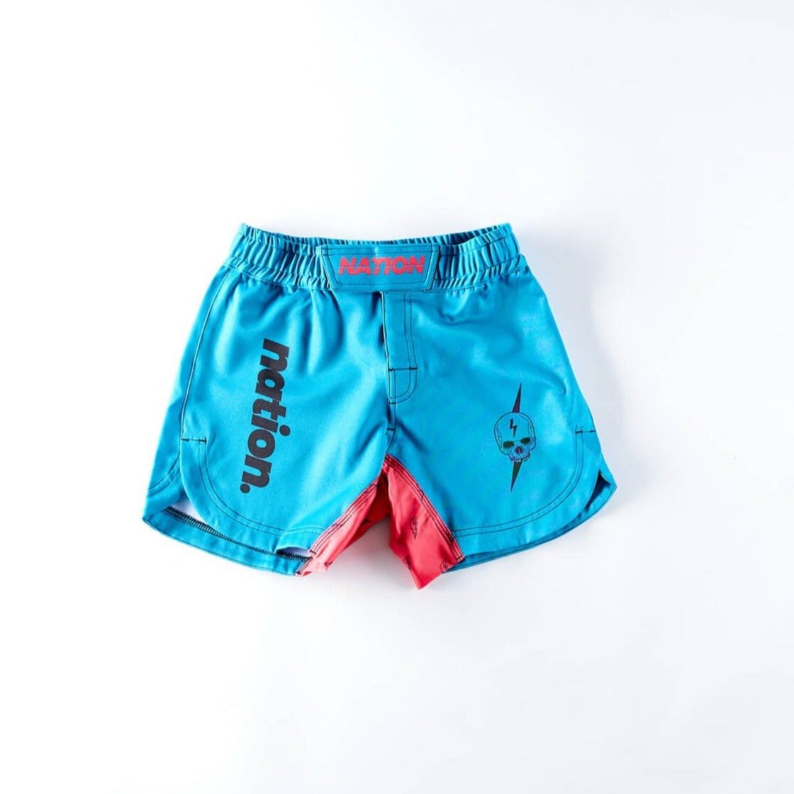 Blue female BJJ grappling shorts with "Nation" logo, red accents, and an elastic waistband for martial arts training.