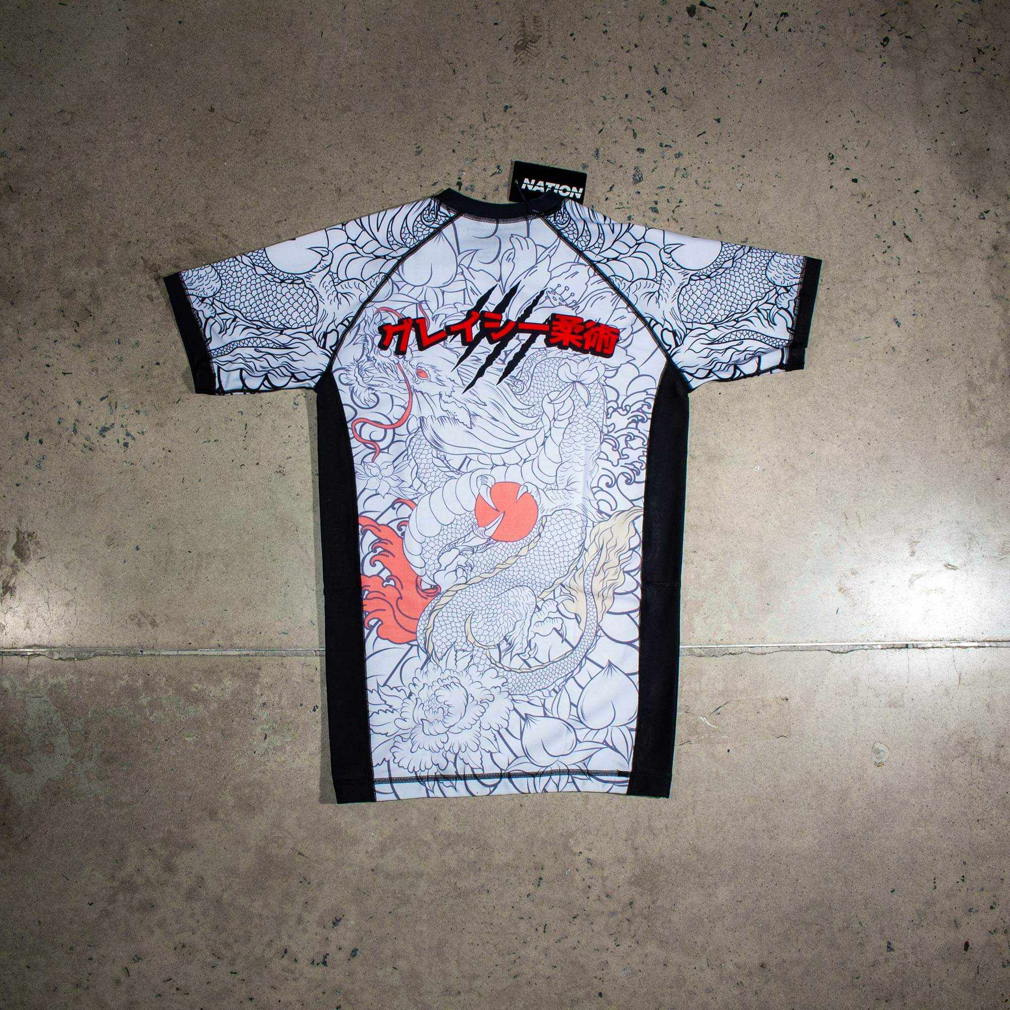 White short sleeve BJJ rash guard with Rising Dragon design for No-Gi Jiu Jitsu and MMA.