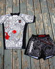 Rising Dragon Kids BJJ Rash Guard Set with dragon-themed design; includes rash guard top and grappling shorts for youth.