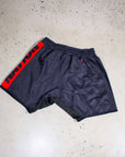 Jiu Jitsu Essentials BJJ Grappling Shorts in black with red accents, featuring an athletic cut and lightweight fabric for optimal movement.