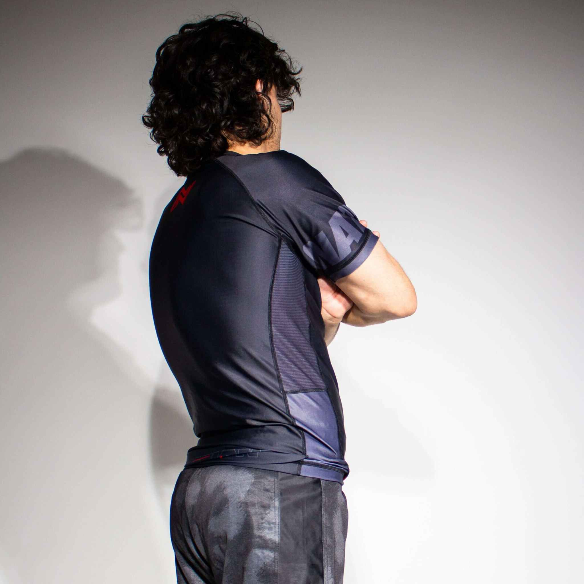 The Jiu Jitsu Essentials BJJ Grappling Shorts and rash guard in model