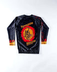 Black Totsugeki Raigeki BJJ Rash Guard with vibrant sublimated graphics, long sleeve, durable spandex/polyester blend.