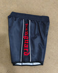 Black and white Vanguard Grappling Shorts by Nation Athletic designed for no-gi athletes with four-way stretch and moisture management