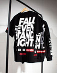 Fall Seven, Stand Eight black nation athletic bjj tee on rolling rack