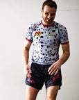 Man wearing The Snow Leopard BJJ Rash Guard with animal print design.