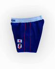 Blue athletic shorts with a logo on a white background