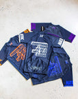 IBJJF Ranked Rash Guard Short Sleeve in multicolor spread out on a floor, showcasing design and text.