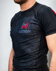 Black short sleeve BJJ rash guard with sublimated print, tailored fit, "Murder Yoga V2" design.