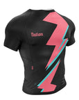 Black BJJ rash guard with bold pink and teal lightning design, short sleeves, and Nation branding.