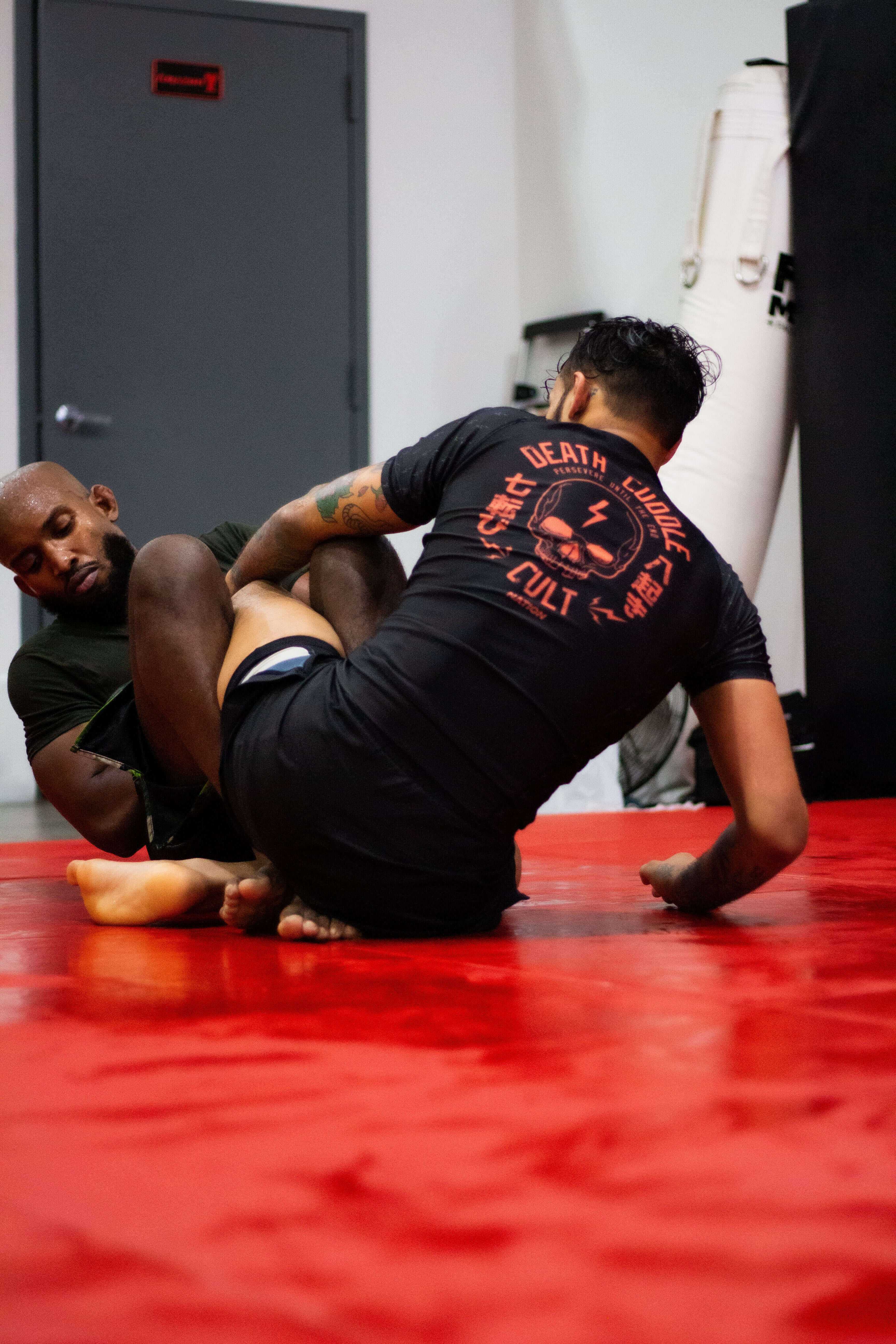 BJJ Rash Guard in Black with Death Cuddles in action 2