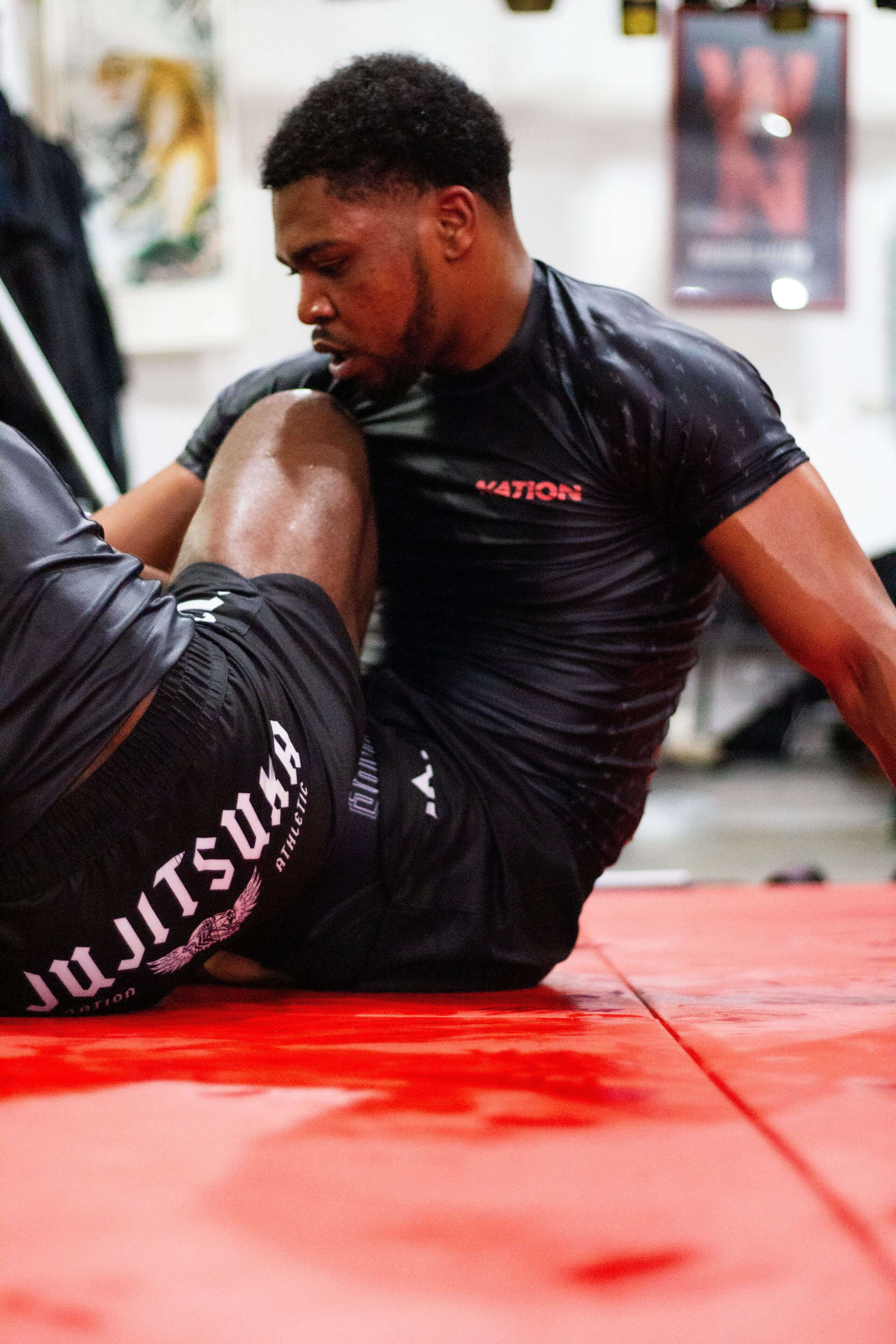 BJJ Rash Guard in Black with Death Cuddles in action 4