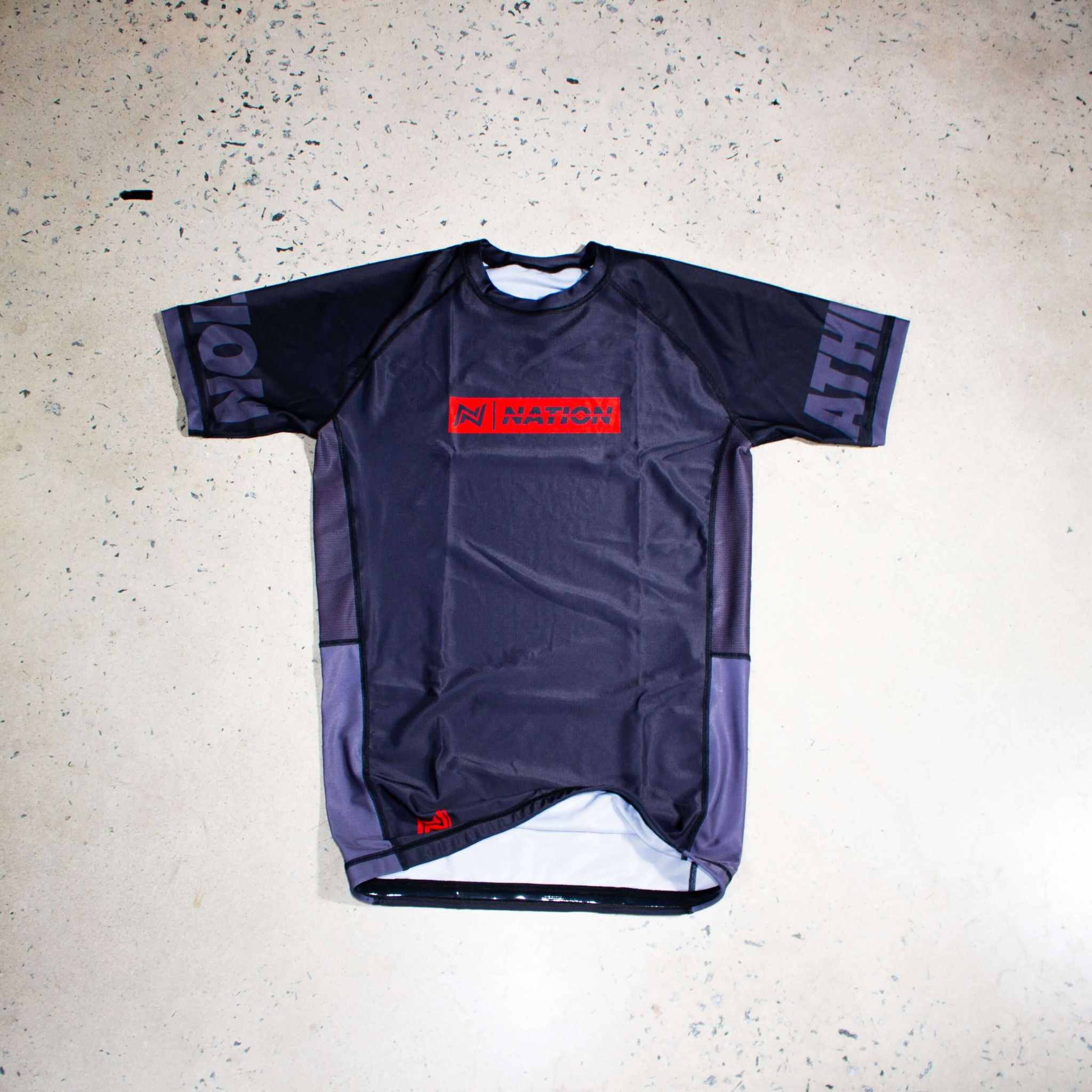 Black Jiu Jitsu Essentials BJJ rash guard with short sleeves and durable, lightweight design.