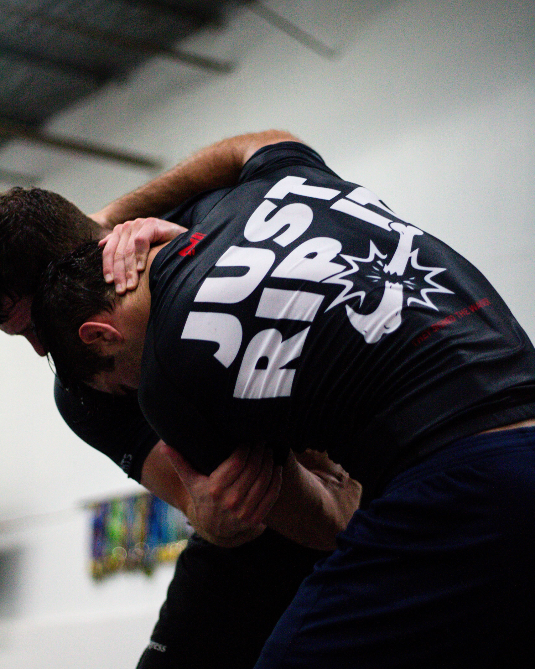 Athlete wearing Just Rip It BJJ rash guard designed for no-gi training and grappling performance