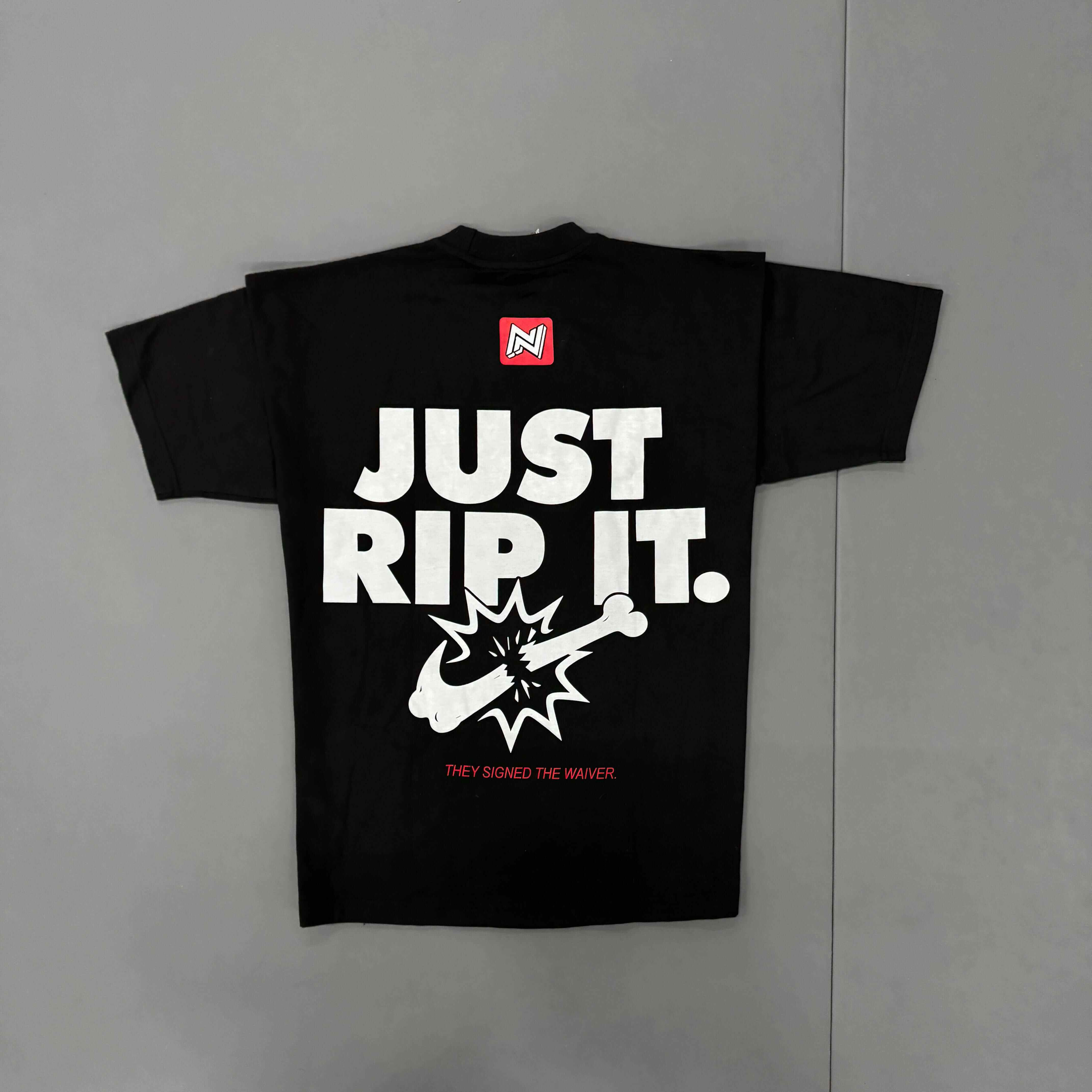 Black t-shirt with 'Just Rip It.' text and graphic on a gray background