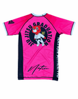 Kanye BJJ Rash Guard in pink with black panels, featuring a cartoon bear in a gi and "Jiu Jitsu Graduation" text on the back, made from moisture-wicking fabric for no-gi training