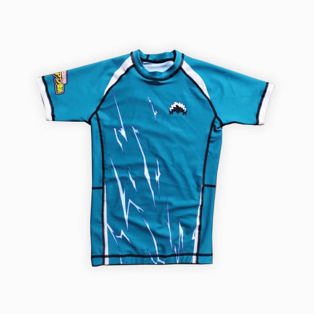Anime-inspired multicolor BJJ kids rash guard with lightning design, promoting My Jiu Jitsu Academia theme.