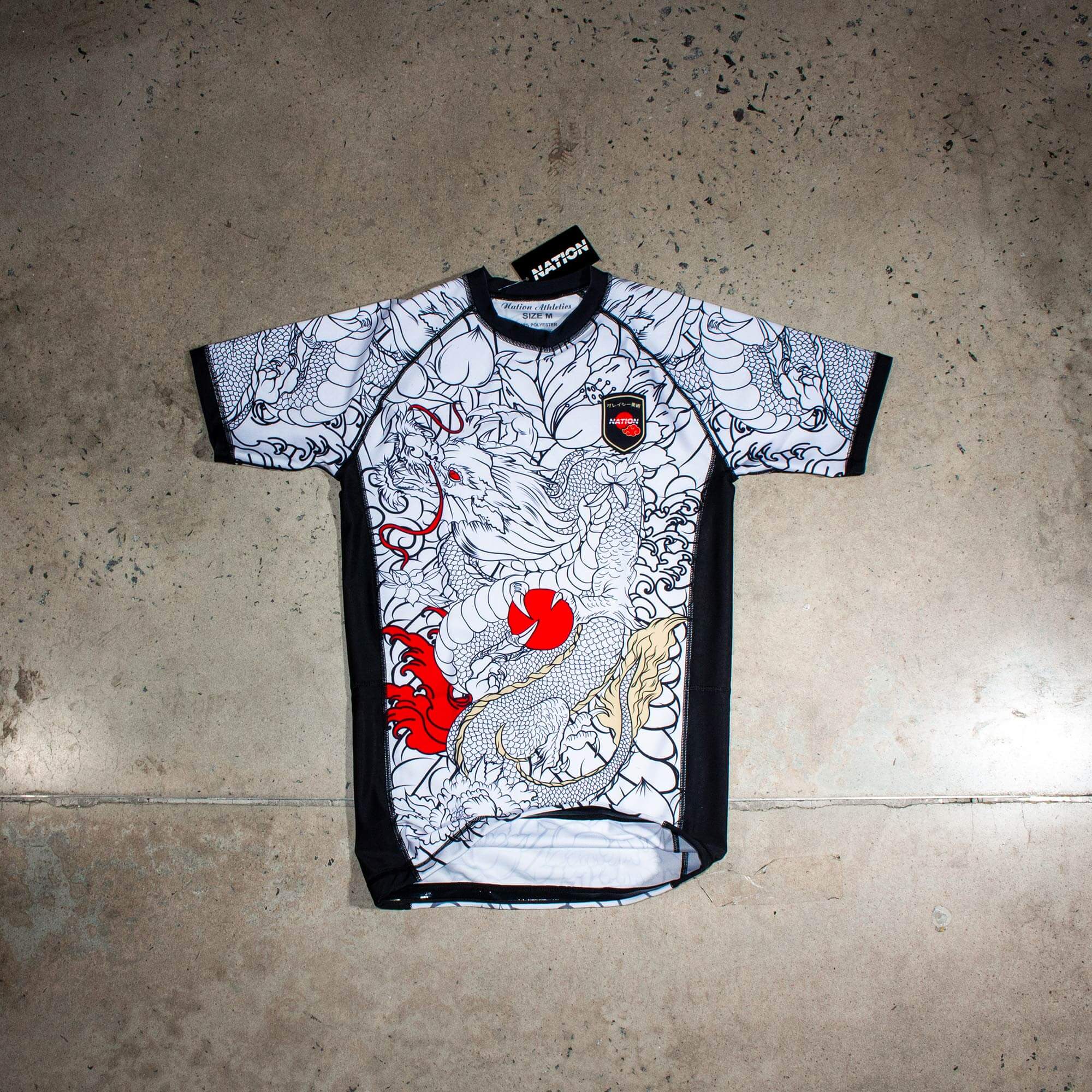 White short sleeve BJJ rash guard with Rising Dragon design for No-Gi Jiu Jitsu and MMA.