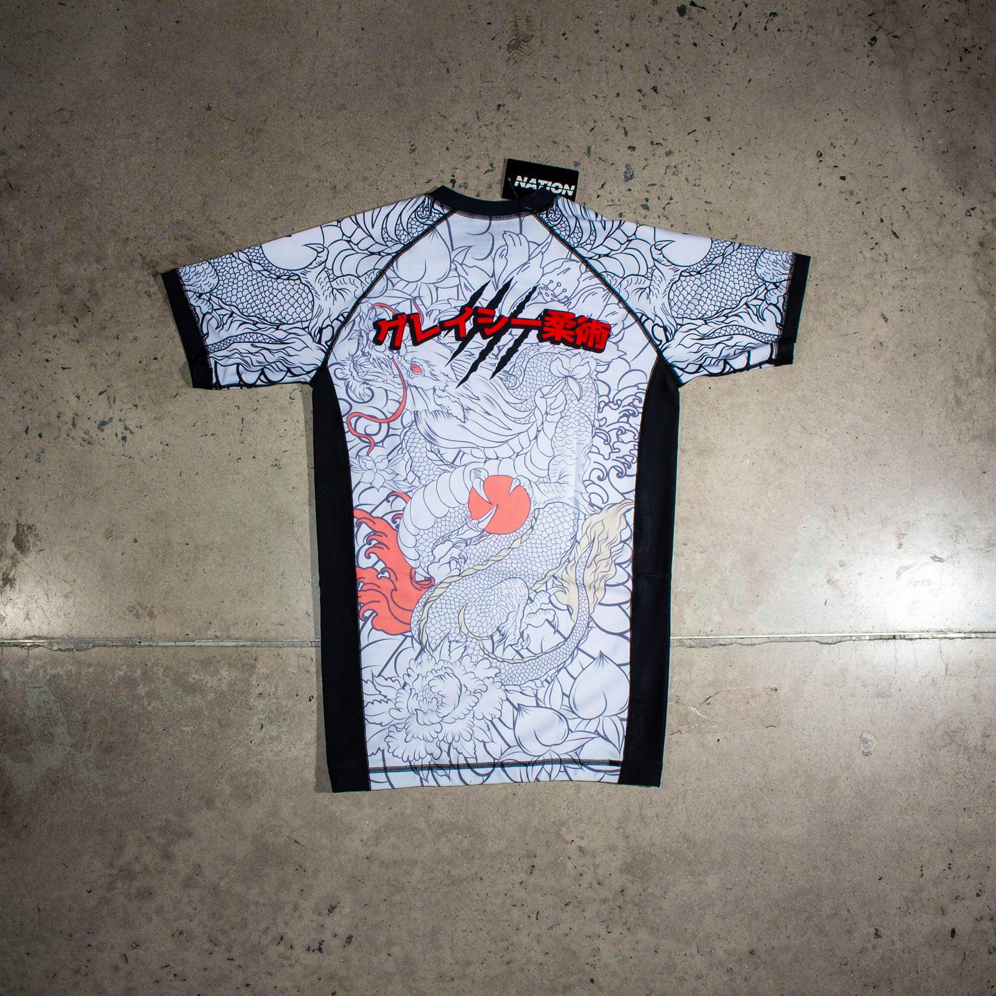 White short sleeve BJJ rash guard with Rising Dragon design for No-Gi Jiu Jitsu and MMA.