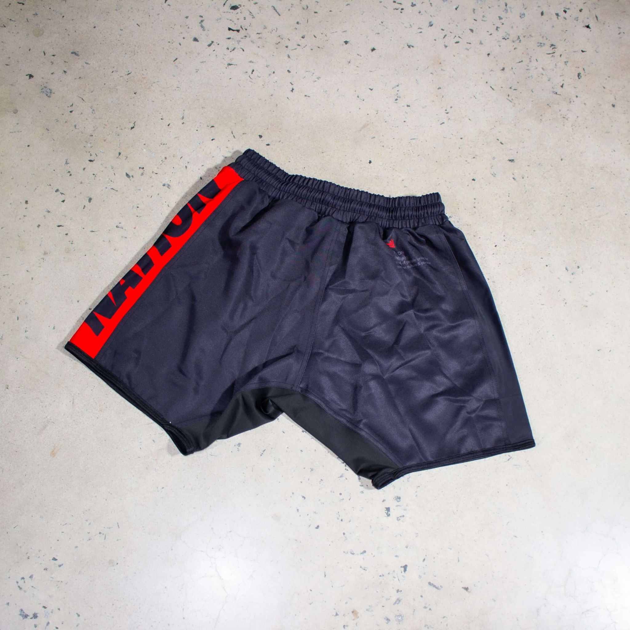 Jiu Jitsu Essentials BJJ Grappling Shorts in black with red accents, featuring an athletic cut and lightweight fabric for optimal movement.