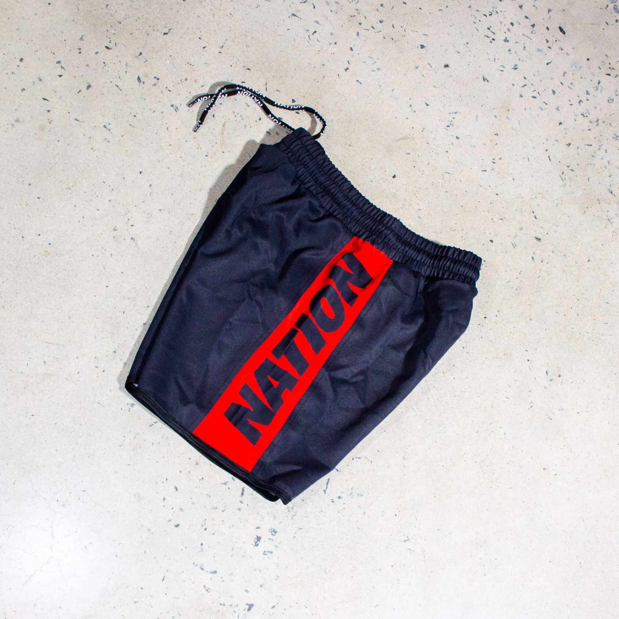Jiu Jitsu Essentials BJJ Grappling Shorts with elastic waistband and red "Nation" logo.