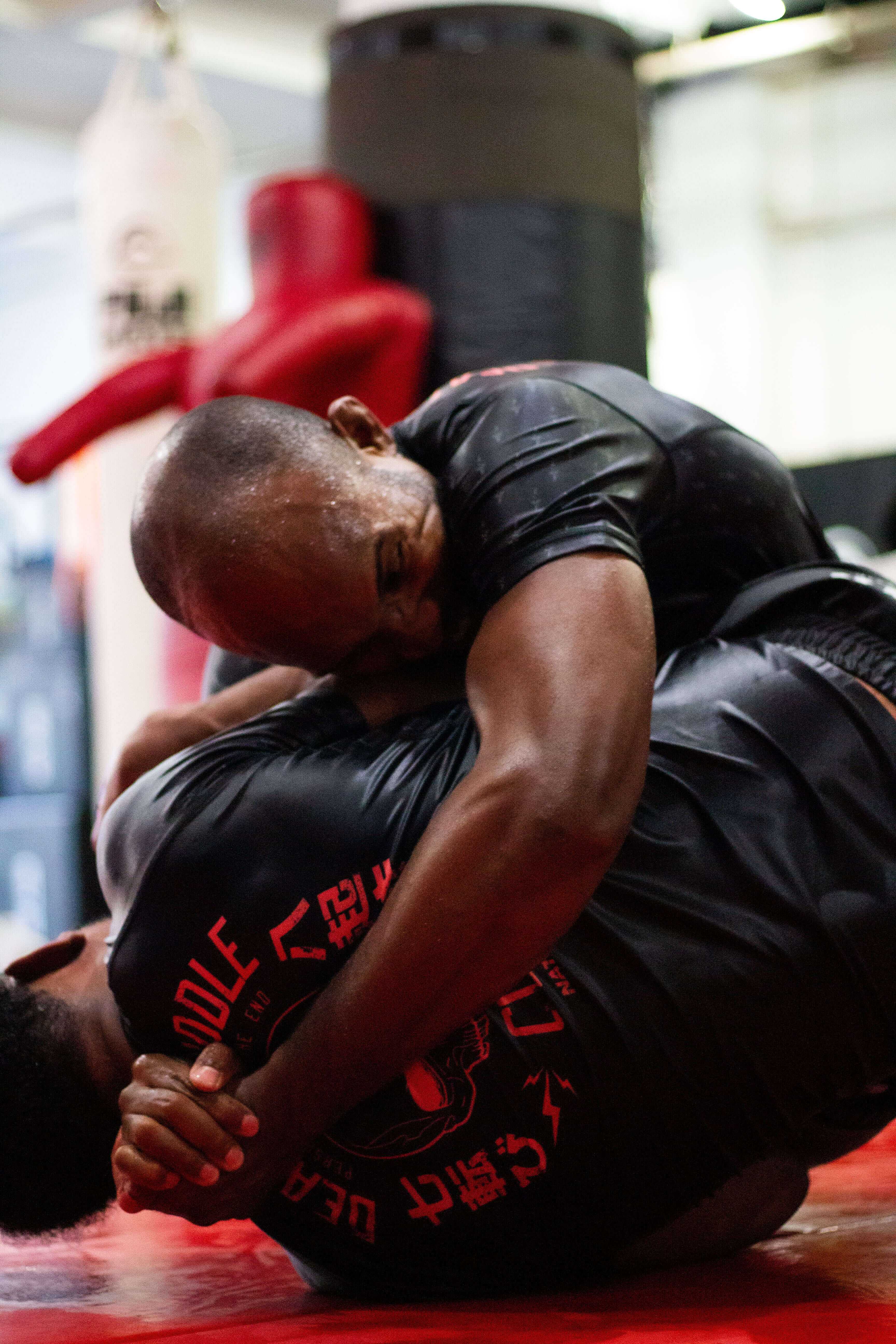 BJJ Rash Guard in Black with Death Cuddles in action 5