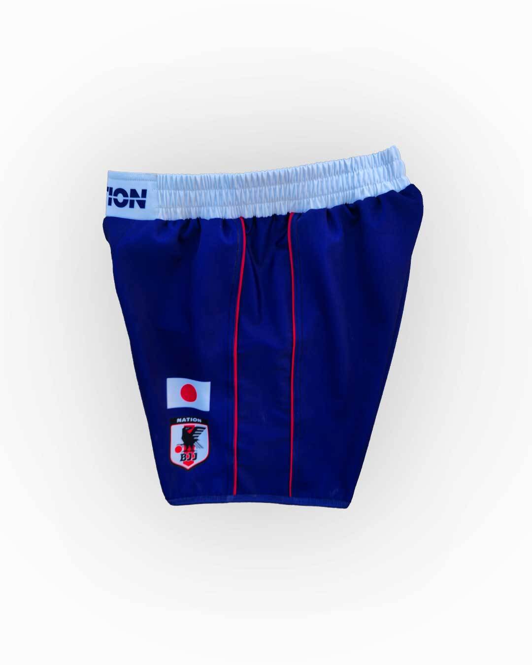 Blue athletic shorts with a logo on a white background
