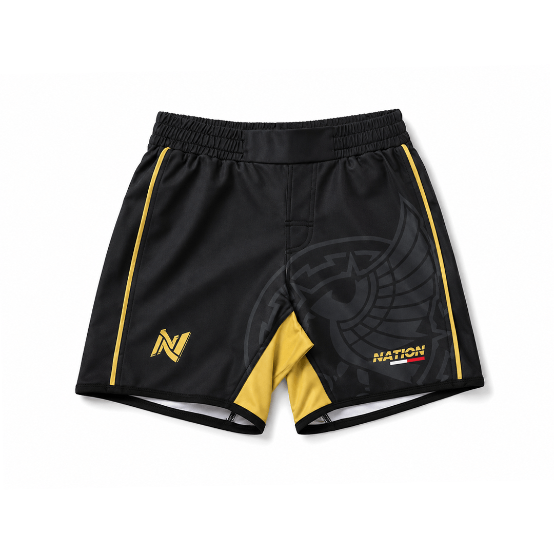 Black and yellow athletic Mexico BJJ shorts with branding on a white background