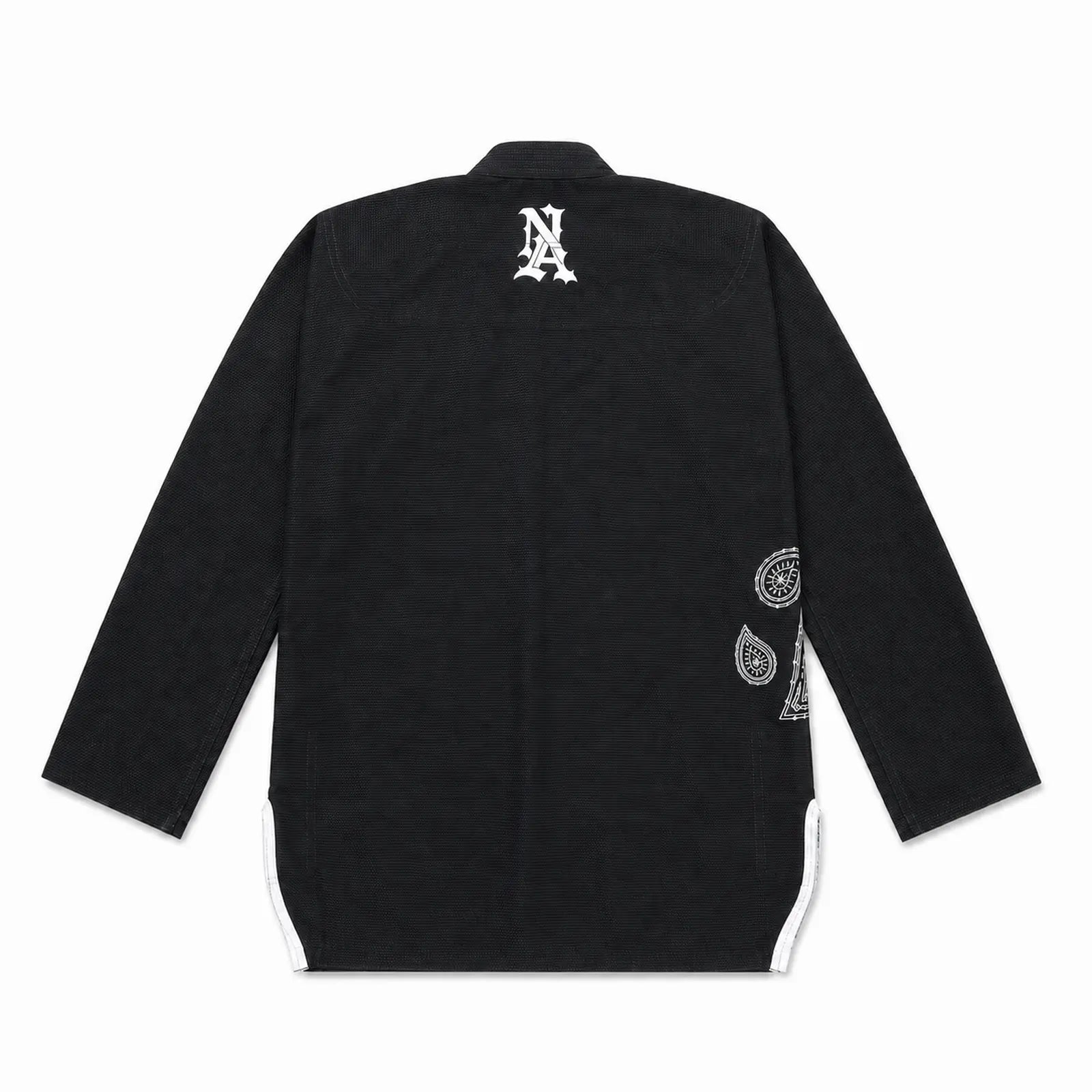 A black bjj gi kimono jacket shown from the back, featuring a white stylized 'NA' logo on the upper back and white circular paisley graphics on the lower back and side panels.