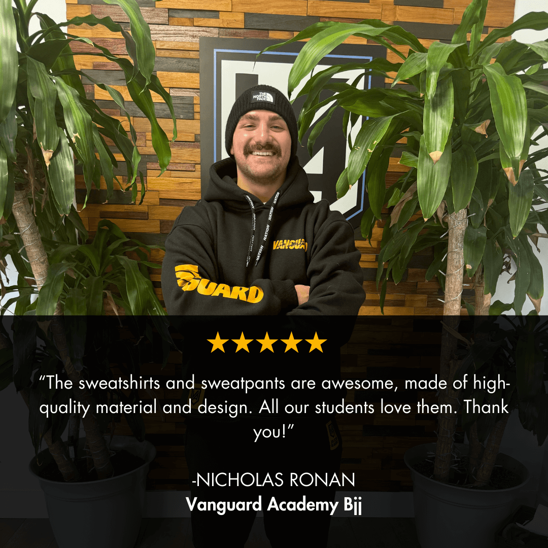 Person wearing a custom wholesale bjj black hoodie with nation athletic customer review overlayed