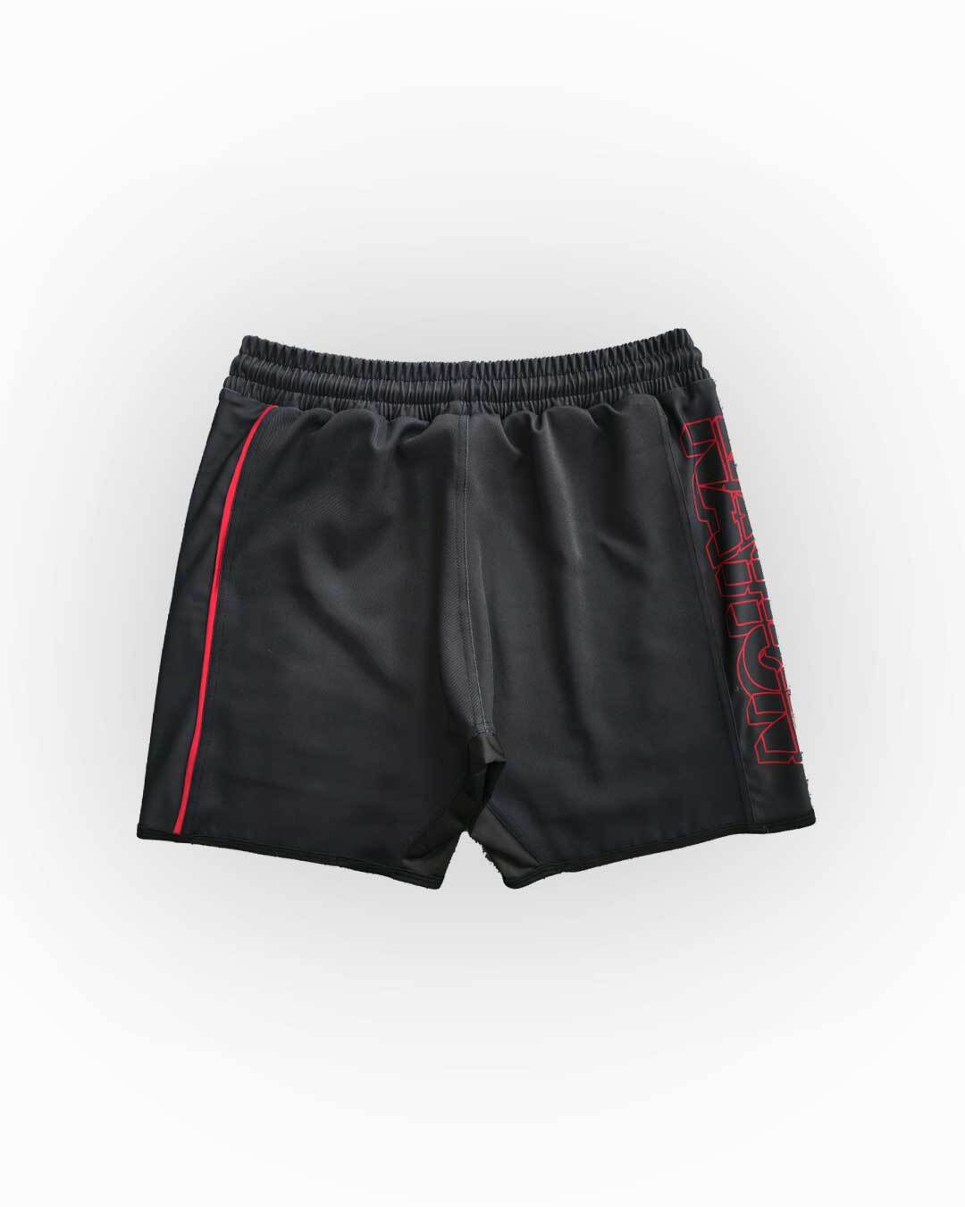 Black shorts with red accents on a white background