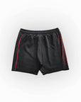 Black shorts with red accents on a white background