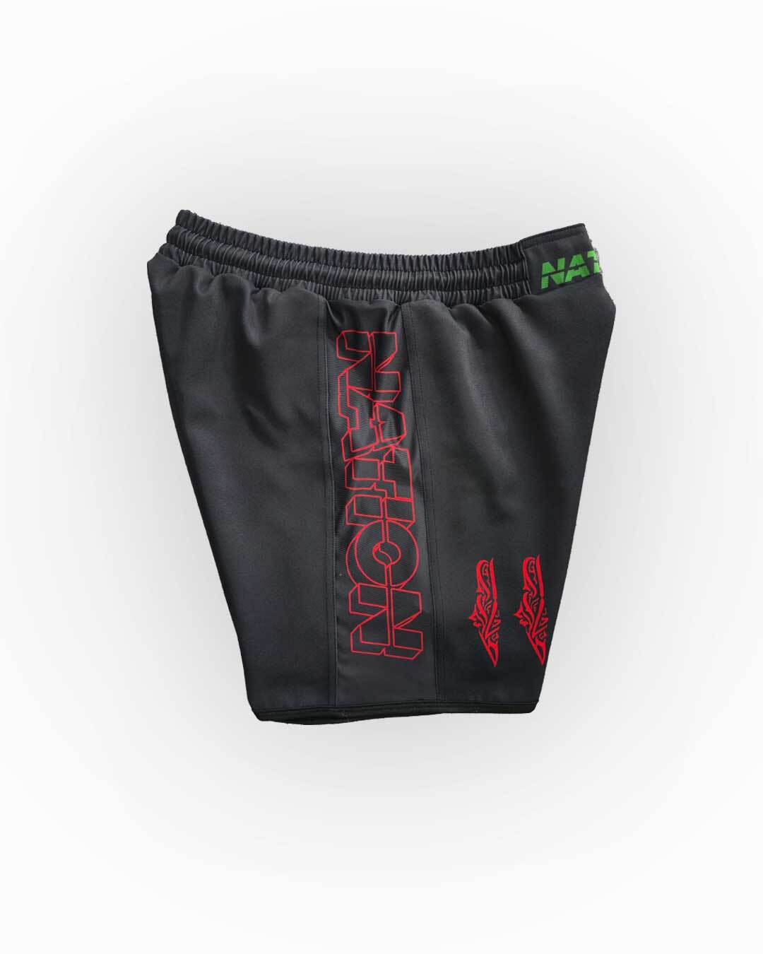Black shorts with red and green text on a white background