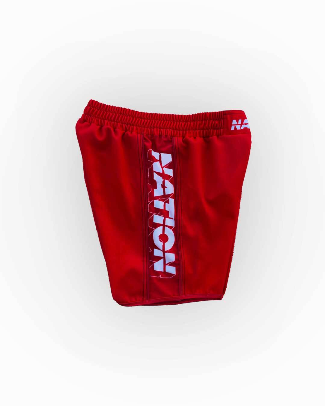 Red shorts with 'NATION' branding on a white background