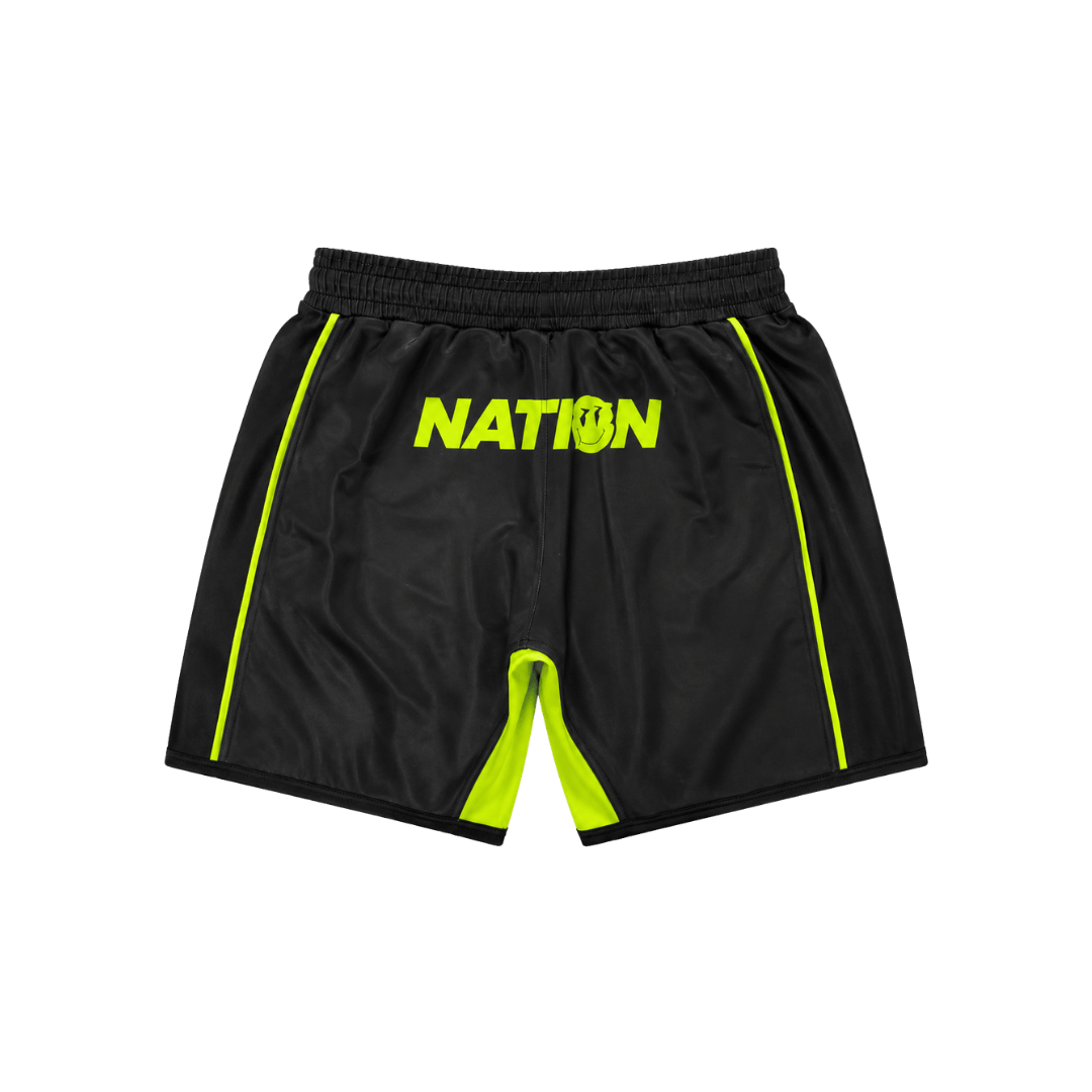 Black shorts with green accents and 'NATION' text on a white background