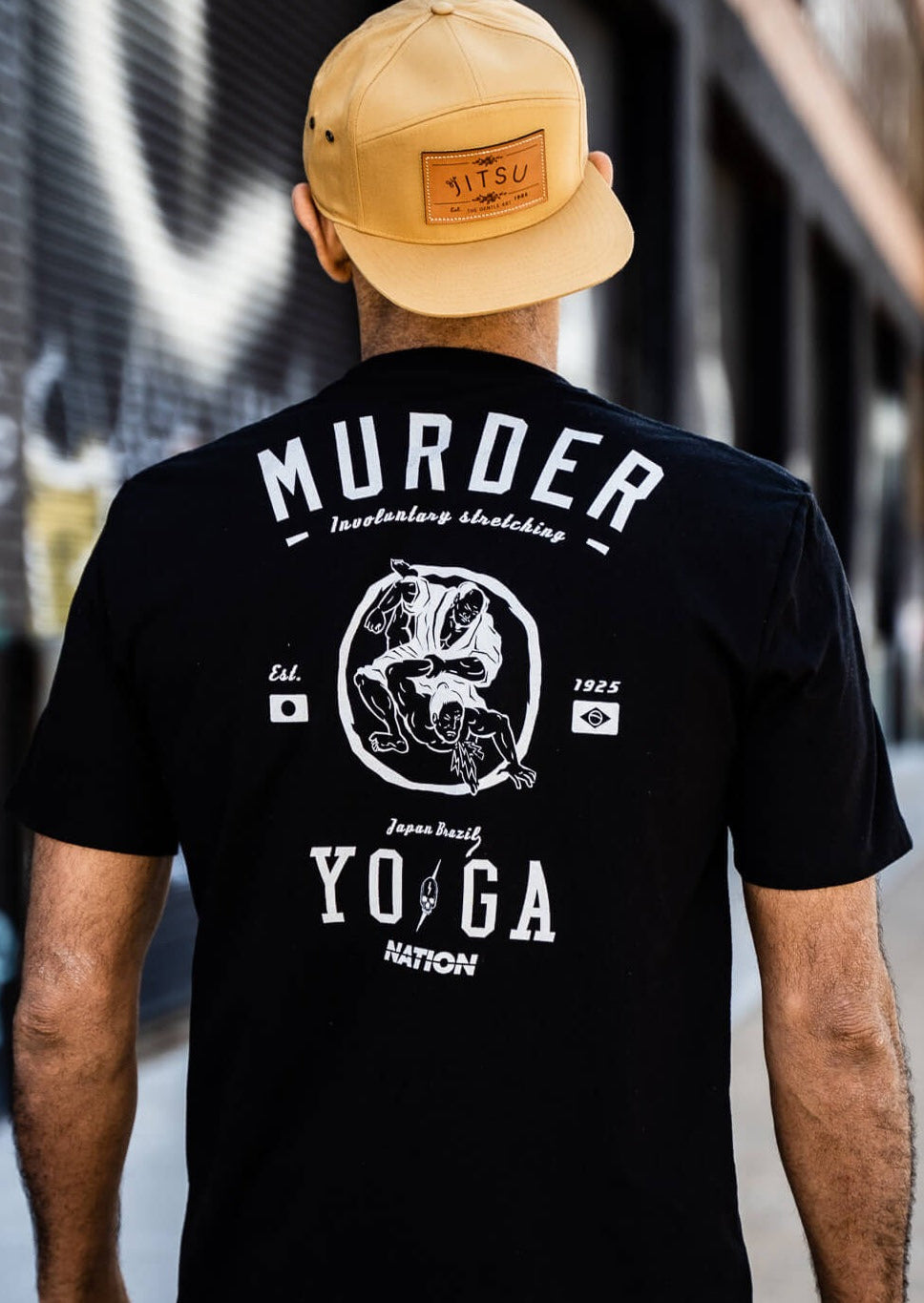 Black BJJ tees featuring &quot;Murder Yoga&quot; design, showcasing Jiu Jitsu culture with a bold back graphic.